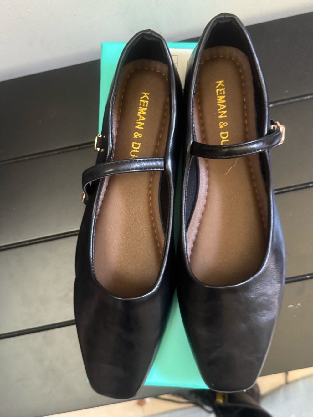 Black leather Mary Janes.